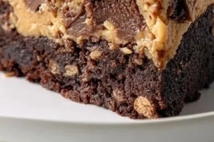 Delicious 1-Bowl Peanut Butter Cup Dump Cake topped with peanut butter cups