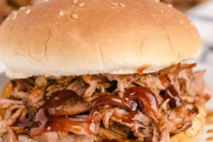 Delicious slow cooker BBQ pulled pork served with coleslaw on a bun