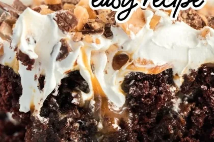 Delicious slice of Better Than Sex Cake topped with whipped cream and chocolate