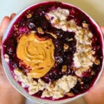 Bowl of Blueberry Chia Oats topped with fresh blueberries and chia seeds