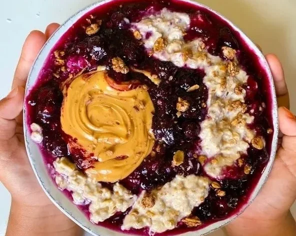 Bowl of Blueberry Chia Oats topped with fresh blueberries and chia seeds