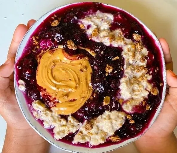 Bowl of Blueberry Chia Oats topped with fresh blueberries and chia seeds
