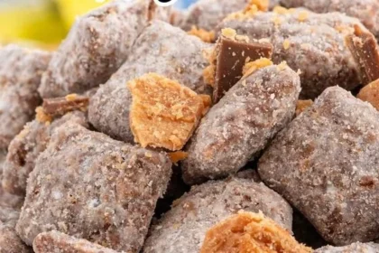 Delicious Butterfinger Puppy Chow made with chocolate and Butterfinger candy