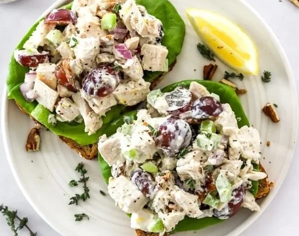 Delicious homemade chicken salad with fresh vegetables and dressing