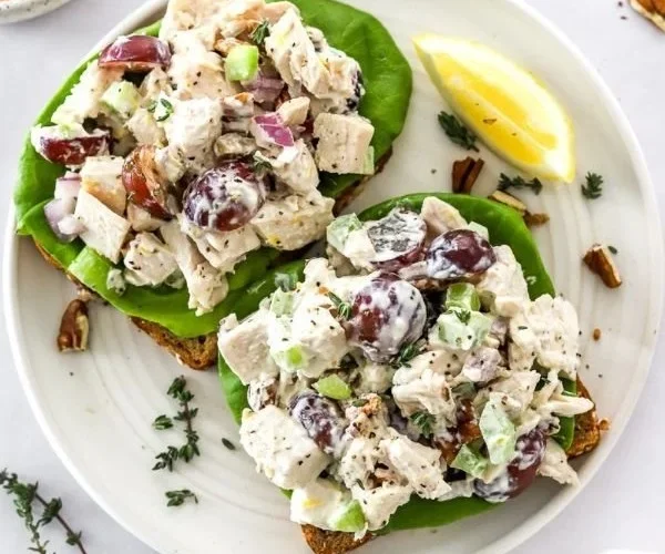 Delicious homemade chicken salad with fresh vegetables and dressing