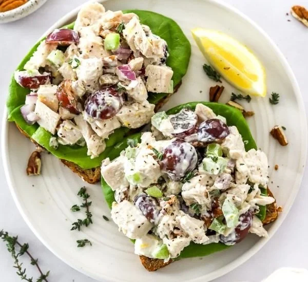 Delicious homemade chicken salad with fresh vegetables and dressing