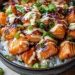 Crispy Salmon served in a rice bowl with colorful vegetables