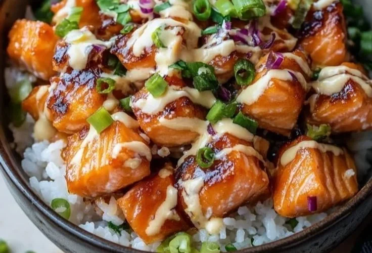 Crispy Salmon served in a rice bowl with colorful vegetables