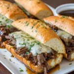 Delicious Crockpot French Dip Sandwiches served with dipping au jus.
