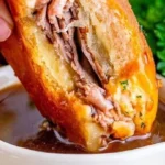 Savory French Dip Sliders served with au jus for dipping.