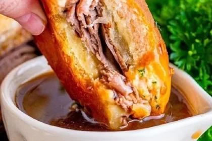 Savory French Dip Sliders served with au jus for dipping.