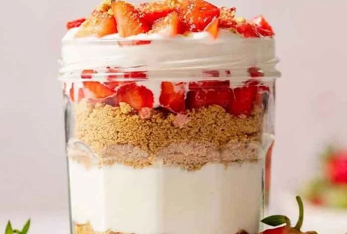 Delicious high protein cheesecake jars ready to enjoy as a healthy dessert.