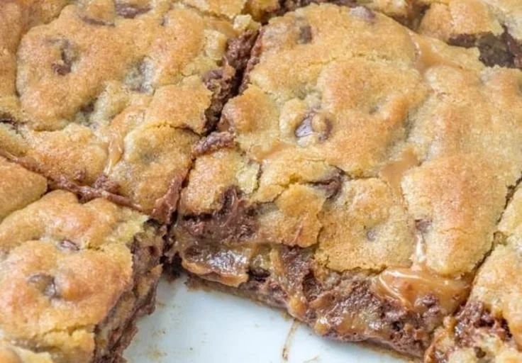 Delicious homemade Knock You Naked Bars on a wooden table