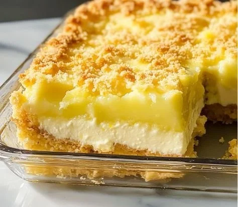 Lemon Cream Cheese Dump Cake topped with lemon zest and berries