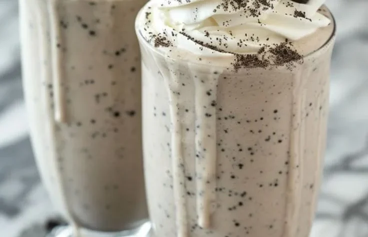 Creamy Oreo Milkshake topped with whipped cream and crushed Oreos