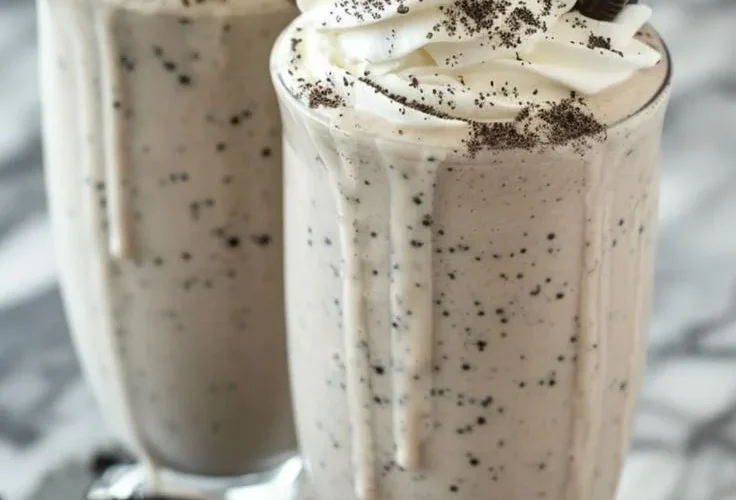 Creamy Oreo Milkshake topped with whipped cream and crushed Oreos
