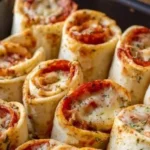 Homemade Pizza Roll-Ups served on a plate with dipping sauce