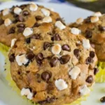 Delicious Banana S'mores Muffins topped with chocolate and marshmallows