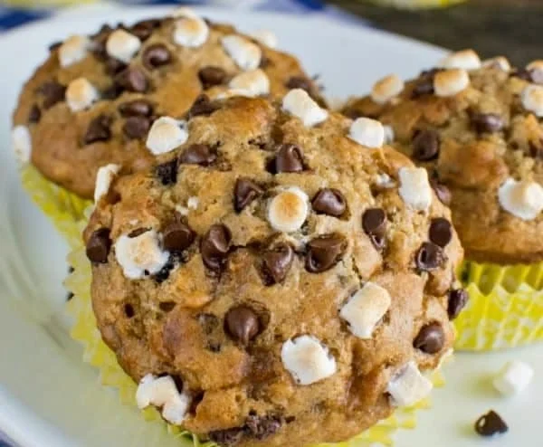 Delicious Banana S'mores Muffins topped with chocolate and marshmallows