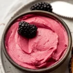 jar of blackberry butter spread on toast