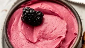 jar of blackberry butter spread on toast
