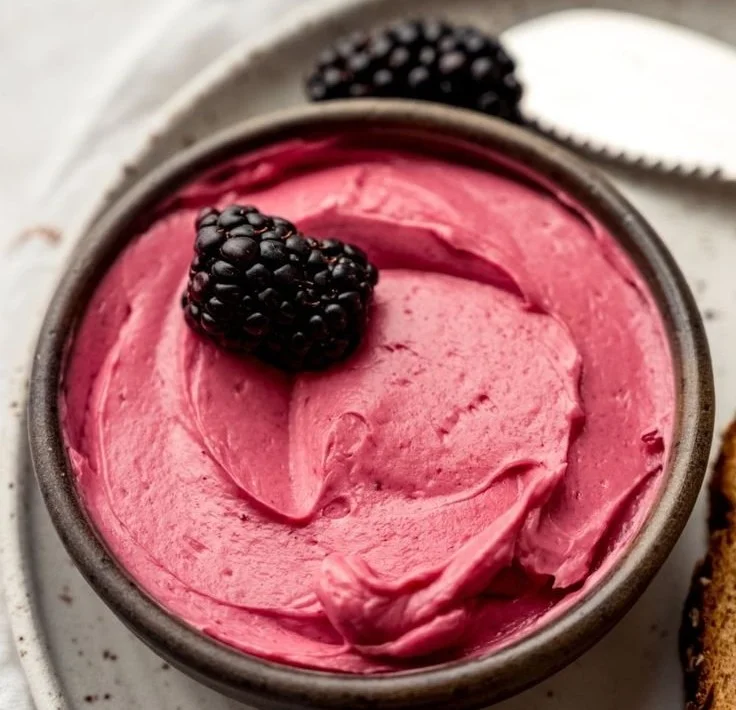 jar of blackberry butter spread on toast