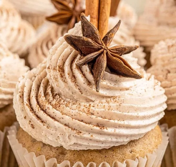Delicious chai latte cupcakes topped with frosting and spices.