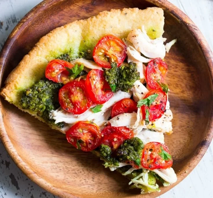 Delicious Chicken Pesto Pizza topped with fresh ingredients and pesto sauce