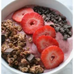 Chocolate Covered Strawberry Smoothie Bowl topped with fresh strawberries and chocolate drizzle