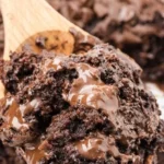A decadent Chocolate Dump Cake topped with chocolate frosting and sprinkles