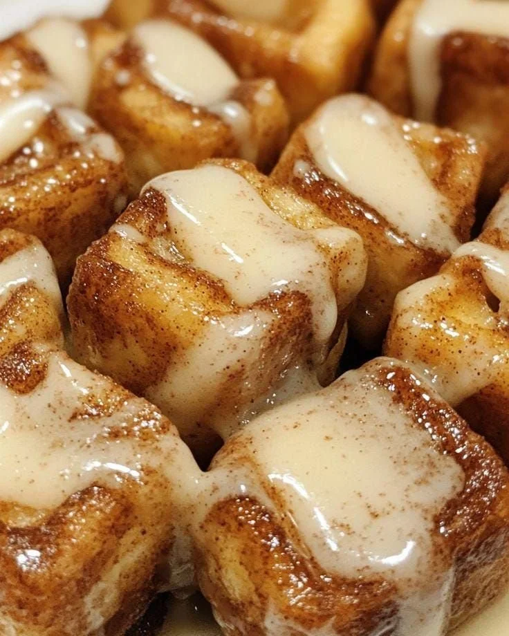 Cinnamon Roll French Toast Bites recipe with syrup and toppings