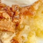 Easy Pineapple Dump Cake ready to serve at a dessert table