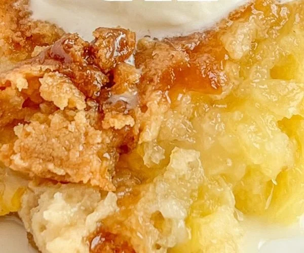 Easy Pineapple Dump Cake ready to serve at a dessert table