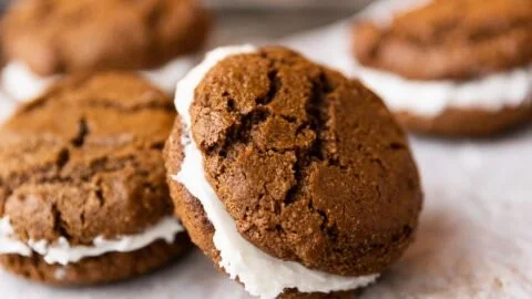 Delicious gingerbread cookie sandwiches filled with tasty frosting
