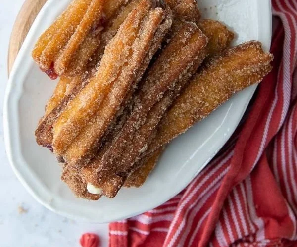 Delicious gluten free churros served with chocolate sauce