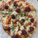 Delicious homemade pizza topped with fresh ingredients and melted cheese.