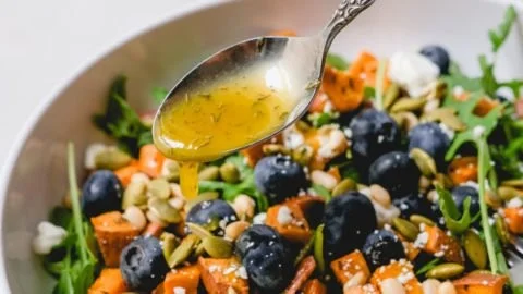 Honey Sweet Potato Summer Salad served in a bowl with fresh ingredients