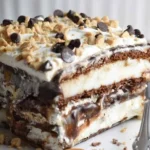 Delicious homemade Ice Cream Sandwich Cake topped with chocolate syrup and sprinkles