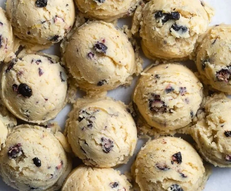 Plate of freshly baked lemon blueberry cookies with a citrusy glaze