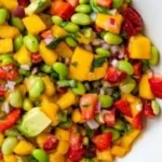 Mango Strawberry Avocado Salsa with edamame served in a bowl