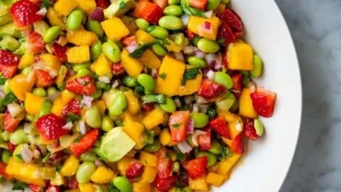 Mango Strawberry Avocado Salsa with edamame served in a bowl
