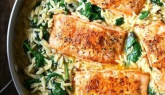 Delicious One Skillet Salmon served with Lemon Orzo on a plate.