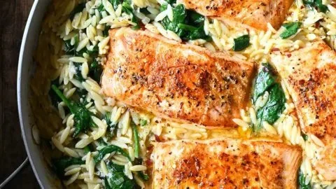 Delicious One Skillet Salmon served with Lemon Orzo on a plate.