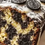 Delicious slice of Oreo Banana Bread topped with chocolate and bananas