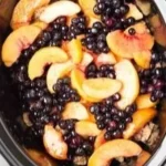 Delicious slow cooker blueberry peach cobbler served in a dish