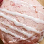 Delicious and fresh strawberry cookies on a plate decorated with mint leaves