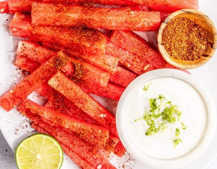 Tajin-coated spicy watermelon fries served on a plate