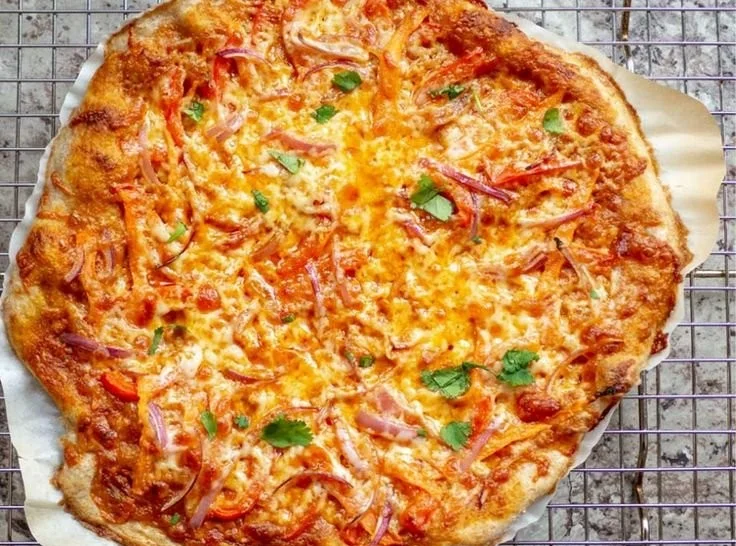 Delicious Thai Curry Pizza topped with fresh ingredients and vibrant flavors.