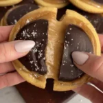 Paleo-friendly Twix Cookies topped with caramel and chocolate.