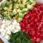 Delicious bowl of avocado crack dip ready to serve with chips